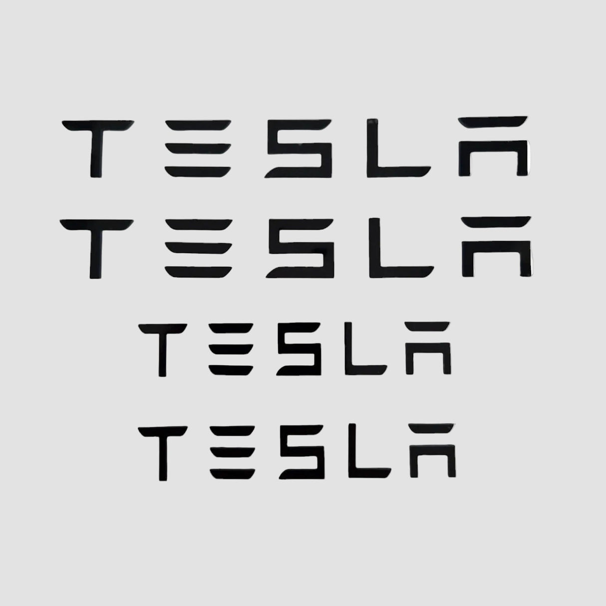 Tesla bokstäver som kan användas istället för logotypen på bilen