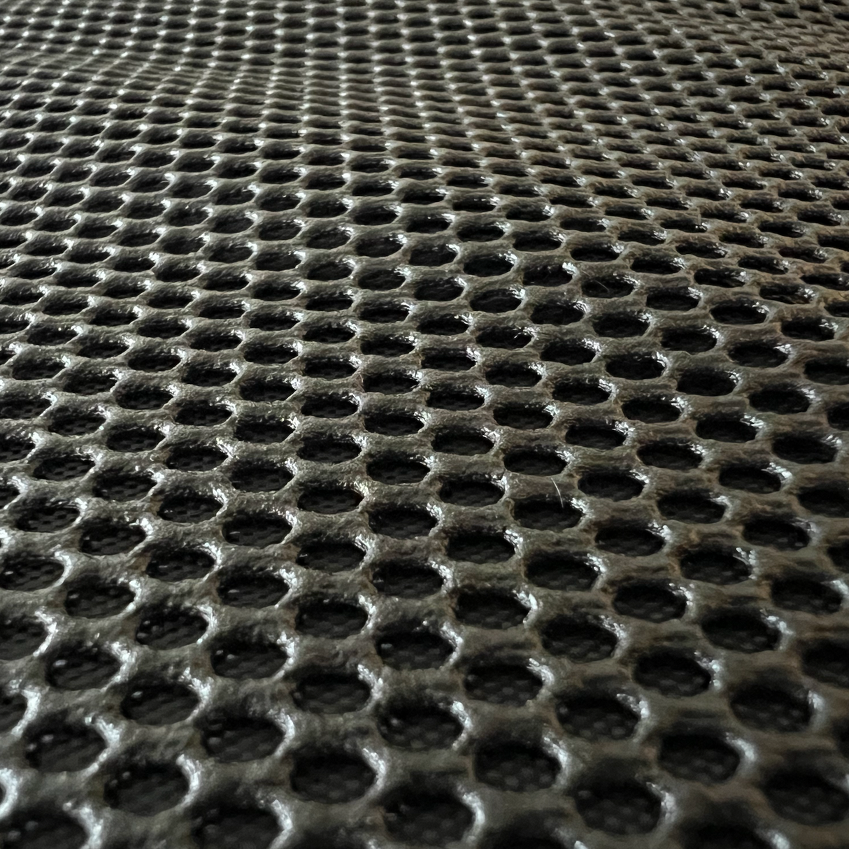 Zooma bild av bilbarnstolsskyddets textil